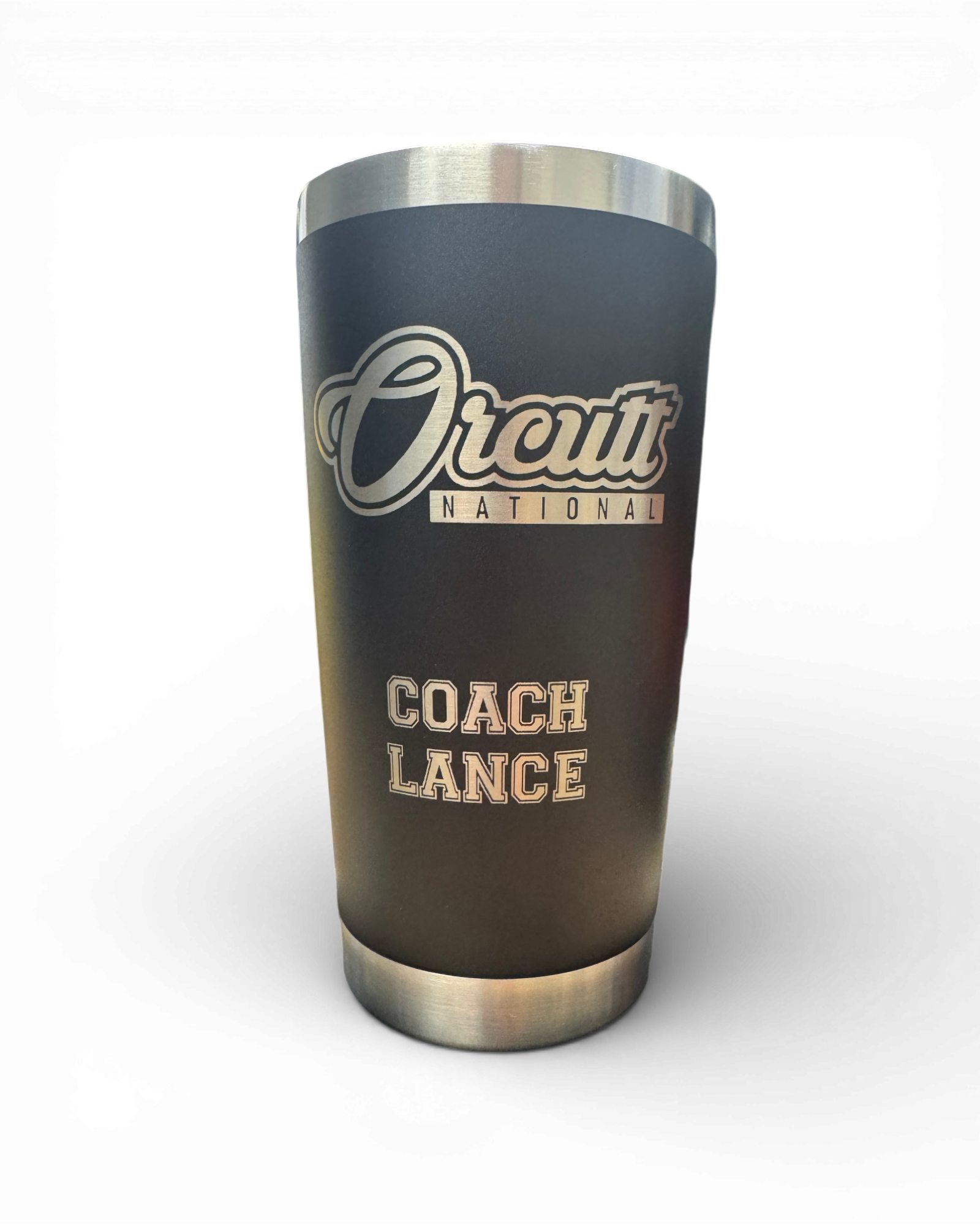 A precision laser-engraved coaches cup on a 20-oz black stainless steel travel tumbler.