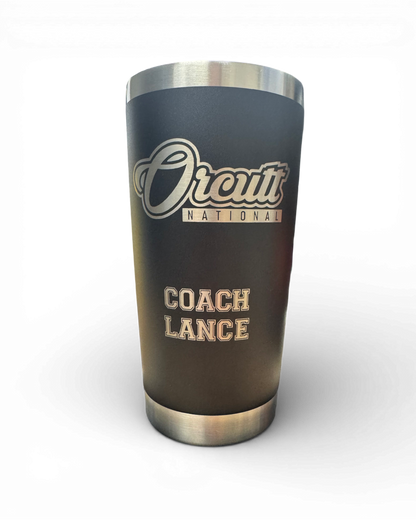 A precision laser-engraved coaches cup on a 20-oz black stainless steel travel tumbler.