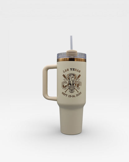 Beige tumbler with handle and straw on a white background