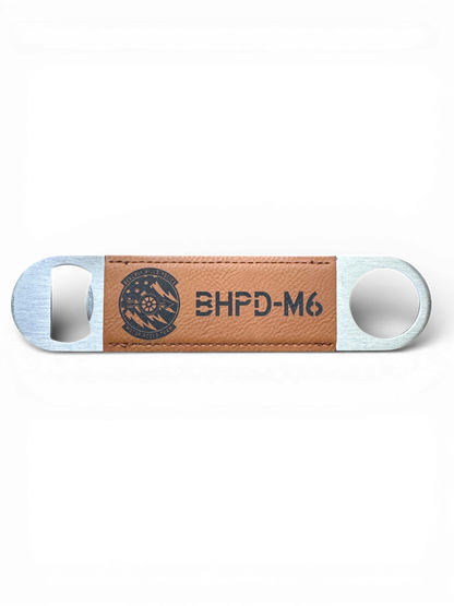 Custom rawhide leatherette-wrapped stainless steel bottle opener with personalized laser-engraved logo.